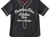 the children ' s baseball jersey is black and has a white logo on it