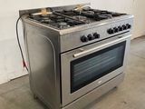 a stainless steel stove with two burners on top of it
