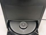 a black computer with a cd player on top of it