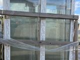 a large window that is on top of a pallet