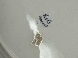 a close up of a white plate with a number on it