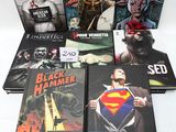 a lot of comic books that are on the table