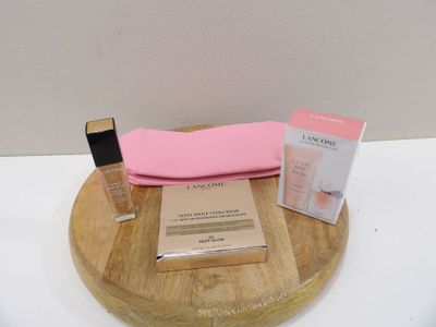 a wooden tray with a pink case and a pink bag