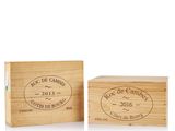 a couple of wooden boxes sitting next to each other on a white surface