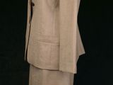 an image of a woman ' s suit and skirt on a mannequin mannequin