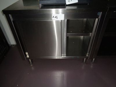 a stainless steel cabinet with a sign on it