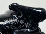 a black statue of an elephant that is sitting on a table