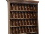 an old wooden bookcase with a lot of books on it