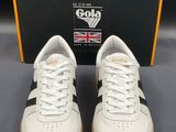 a close up of a pair of white and black sneakers