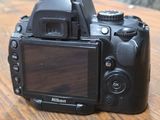 a camera that is sitting on a wooden table