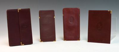 four pieces of red and brown leather are lined up in a row