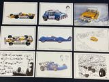 many cards with different cars on them on a table