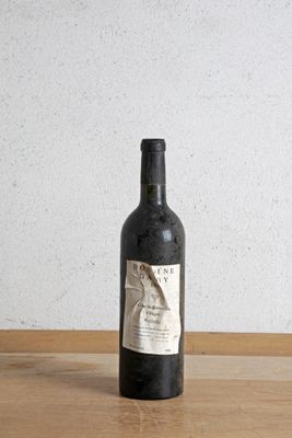 a bottle of wine that is sitting on a table