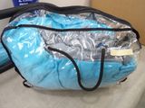 a blue bag with a vacuum in it on a table