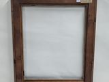 a wooden picture frame with a white background