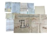 a lot of old papers that are on a table