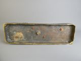 a metal box that has a bunch of screws on it