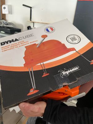a man holding a box with a picture of a fire hydrant inside of it
