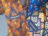 three different colored ties laying next to each other on a table