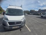 a white van that is parked in a parking lot