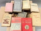 several books are stacked on top of each other on a table