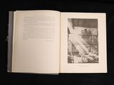 an open book with a black and white photo on it