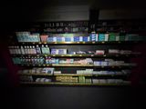 a lot of cigarettes on the shelves in the store