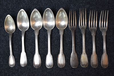 six spoons and six forks are lined up on a black surface
