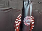 a punching bag hanging on a wall in a gym