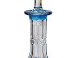 blue glass decanter with a clear top on a white background