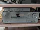 an image of a stereo system sitting on top of a wooden shelf