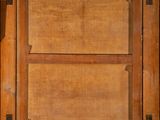an old wooden box with two open doors and a handle
