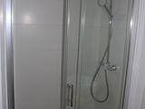 a bathroom with a shower, sink and toilet in it
