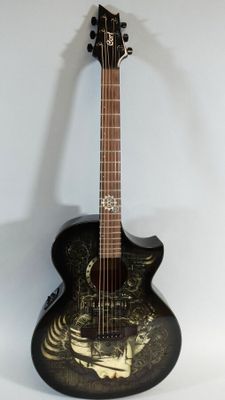a black guitar with a gold design on it