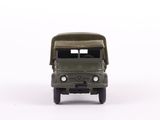 a toy army truck that is sitting on a white surface