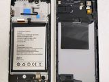 a picture of a cell phone with a battery attached to it