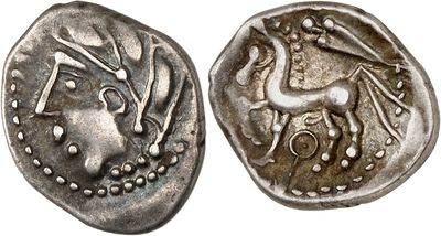 a silver coin with an image of a horse on it