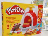 a box of play doh next to a box of pizza
