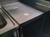a stainless steel sink and a stainless steel sink in a kitchen