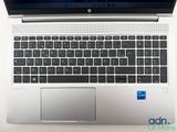 an open laptop computer sitting on top of a white table