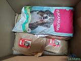 two bags of dog food in a cardboard box