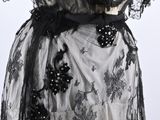 black and white lace dress with black flowers on it