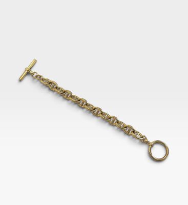 un porte-clés plaqué or muni d'un fermoir