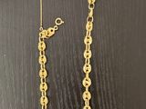 a gold chain that has been made to look like a necklace