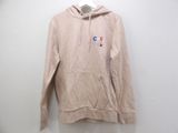 the hoodie is hanging on a hanger on the wall