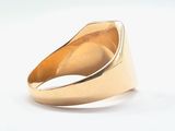 yellow gold signet ring with a diamond set in the center