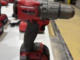 a red cordless drill that is sitting on a table
