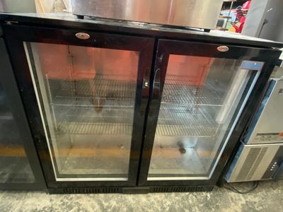 two glass doors on the back of a refrigerator