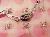 a close up of a pink purse with a chain on it
