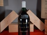 a bottle of wine that is sitting on a table